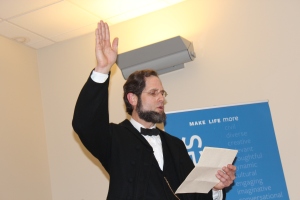 President Abraham Lincoln, as reenacted by Howard Wright, reads his Emancipation Proclamation at Goodwin College.