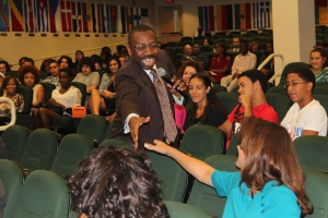 Tyrone Black, Goodwin College Concurrent Enrollment Coordinator, shakes hands with audience members.